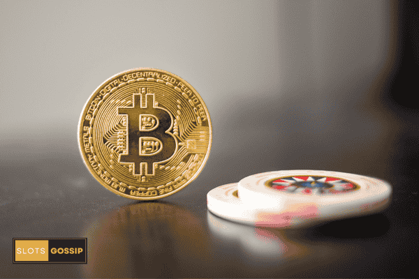 Slots Gossip 131 Bitcoin coin next to casino chips to portray crypto casinos
